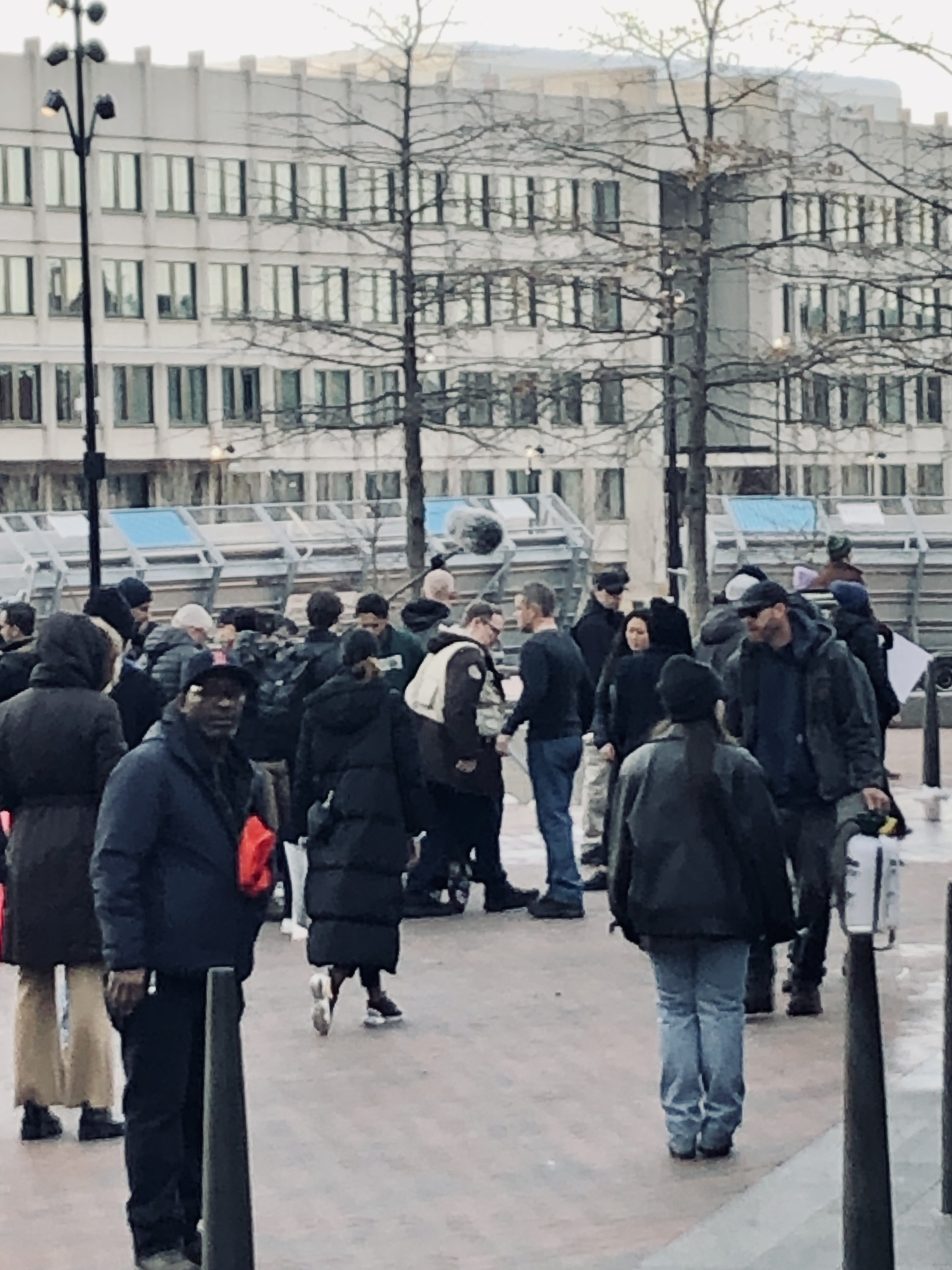 Matt Damon surrounded by movie crew
