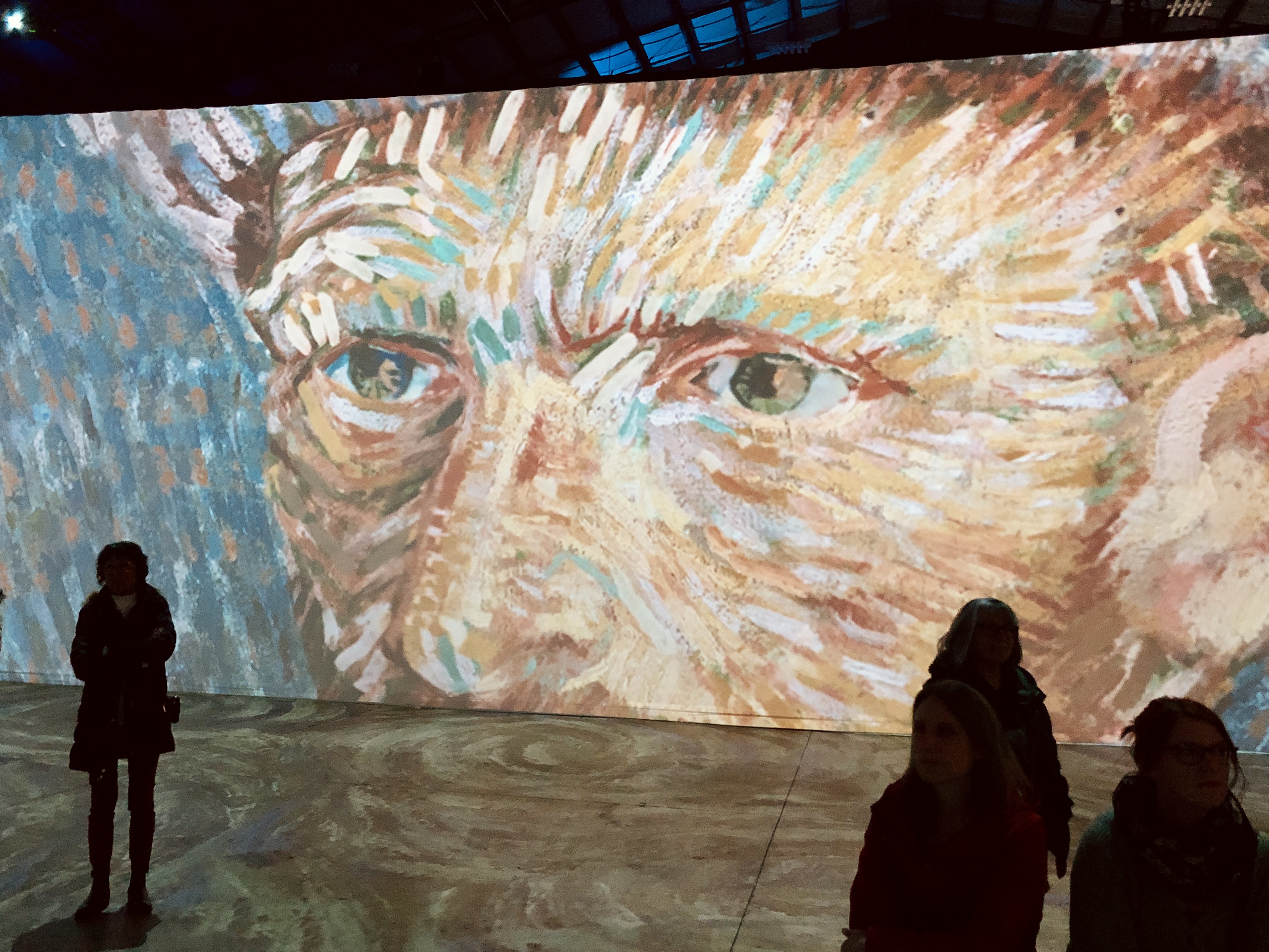 Van Gogh's self-portrait projected onto a large wall