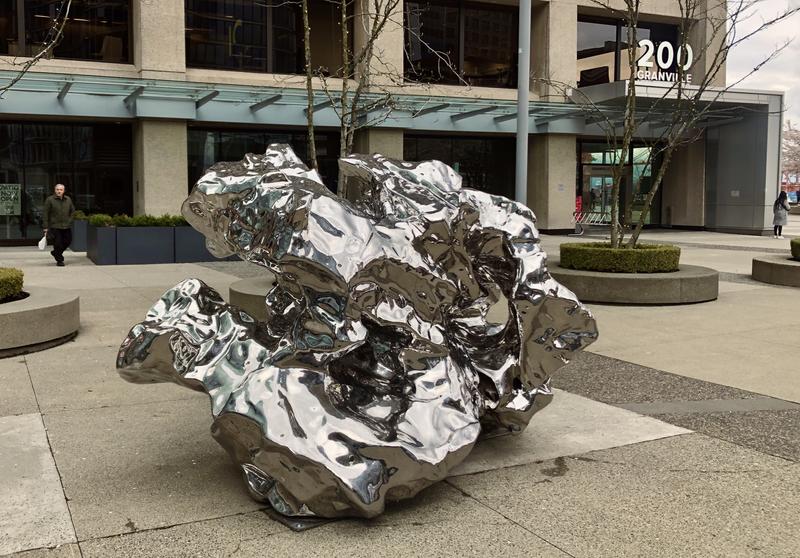 A reflective rock that resembles a crumpled piece of paper